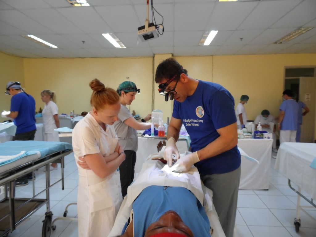 Jay Sandlow doing vasectomy in Danao, Maria Nielsen from Denmark looks on